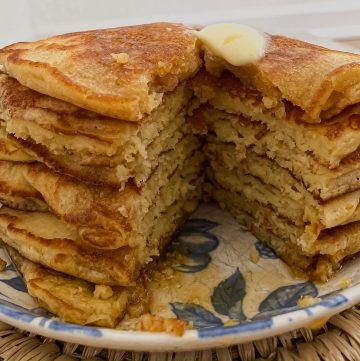 Stack of pancakes with a bite taken out