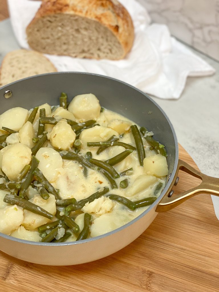 new potatoes in a garlic cream sauce with green beans