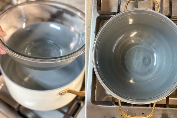 white pot with gold handles on a stove top, with a clear bowl inside it to create a double boiler. 