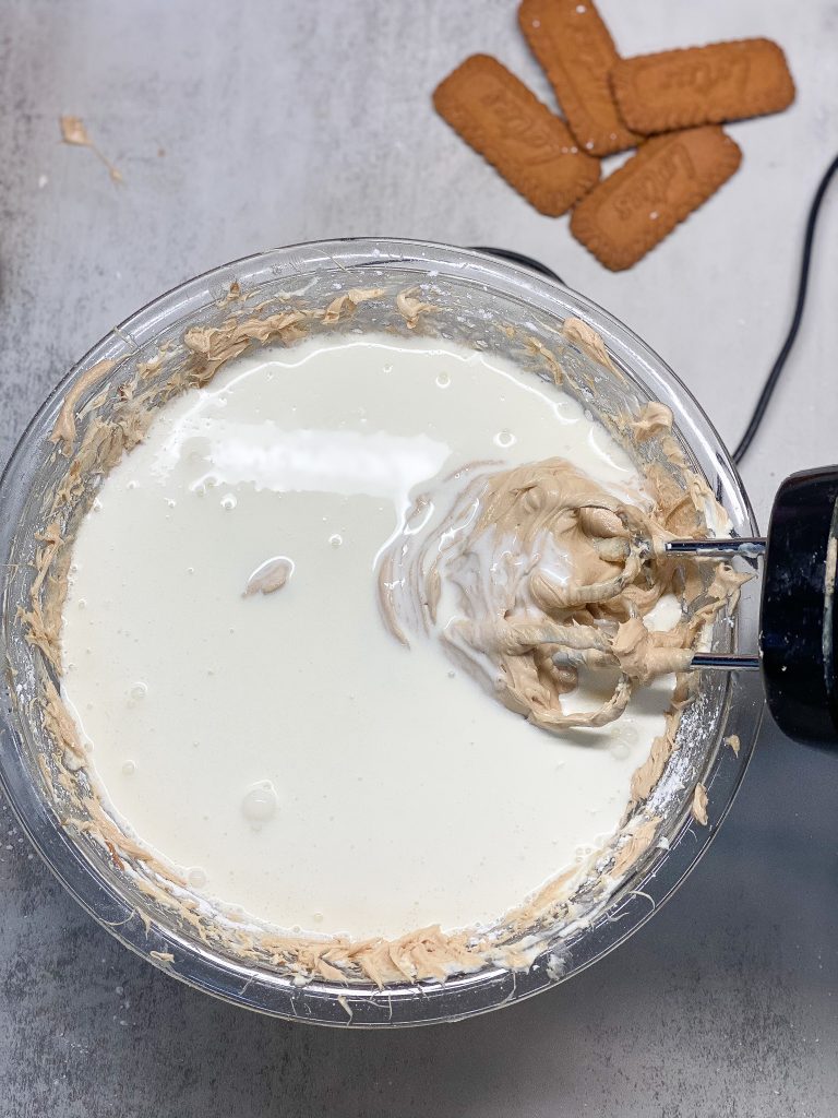 heavy whipping cream added to biscoff cream cheese mixture