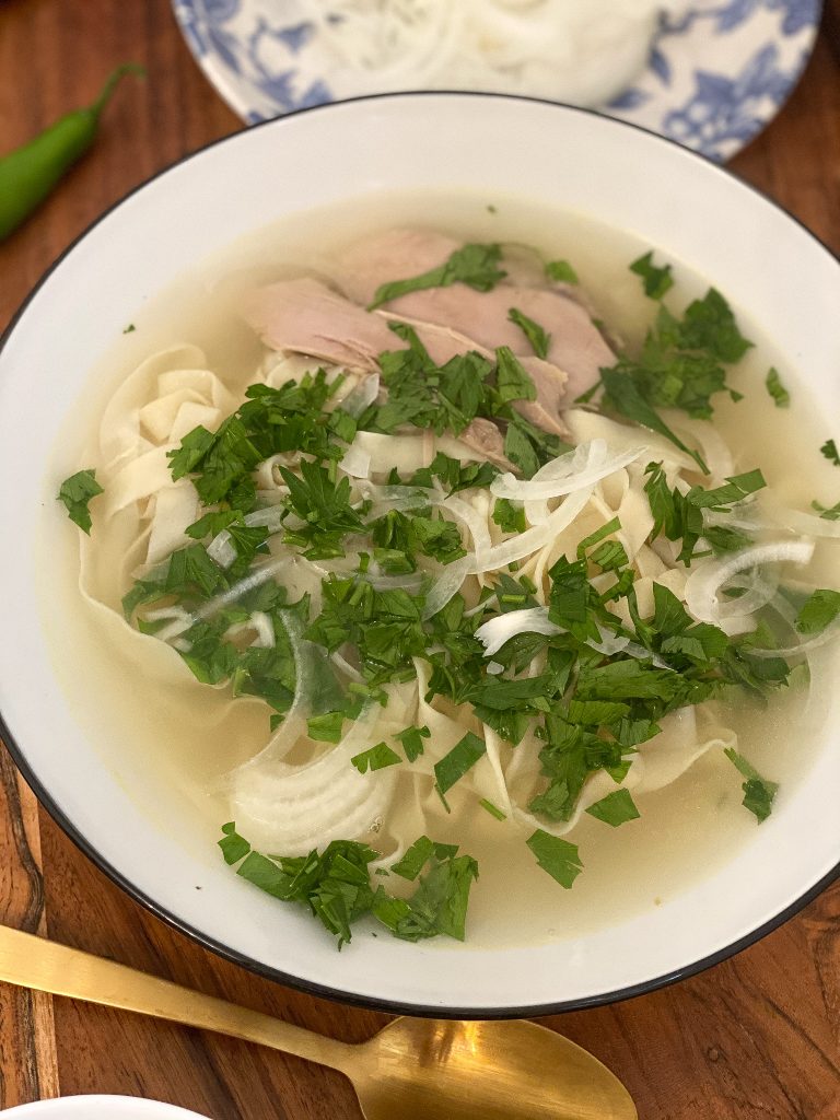 homemade noodles in a homemade chicken bouillon soup