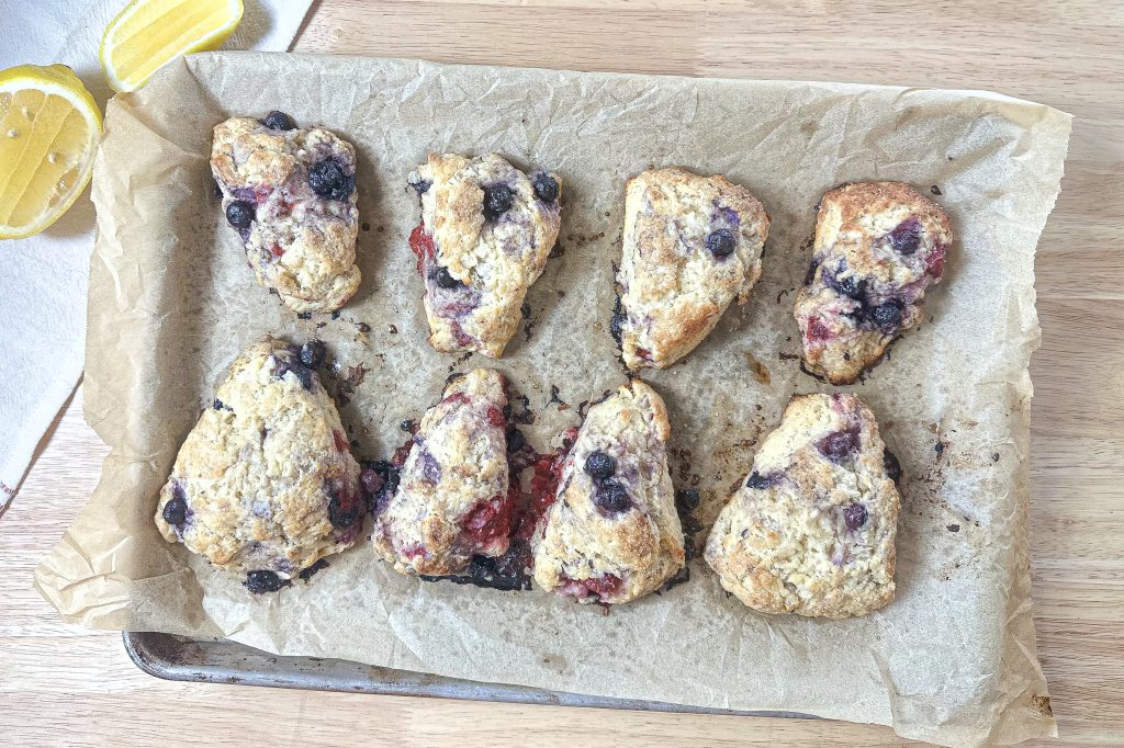 baked scones on a parchment lined baking sheet