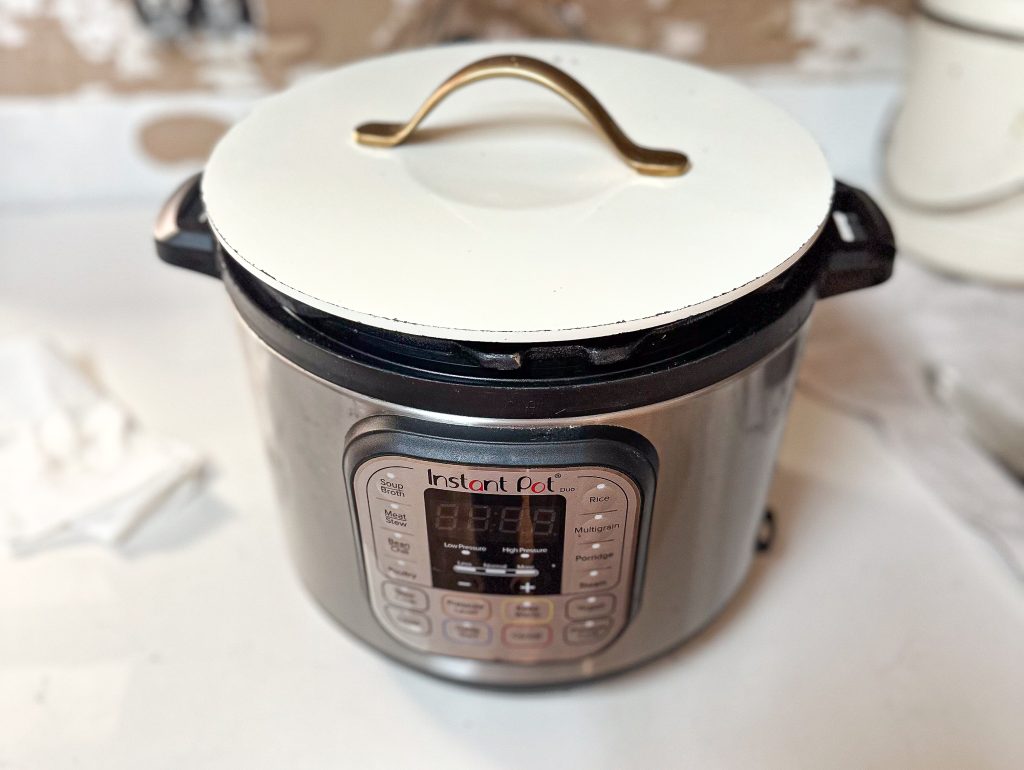 instant pot with a white lid on it with the yogurt setting on