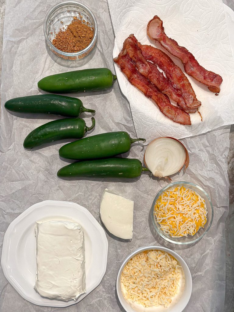 ingredients laid out on parchment paper to make Mexican inspired jalapeño poppers with bacon