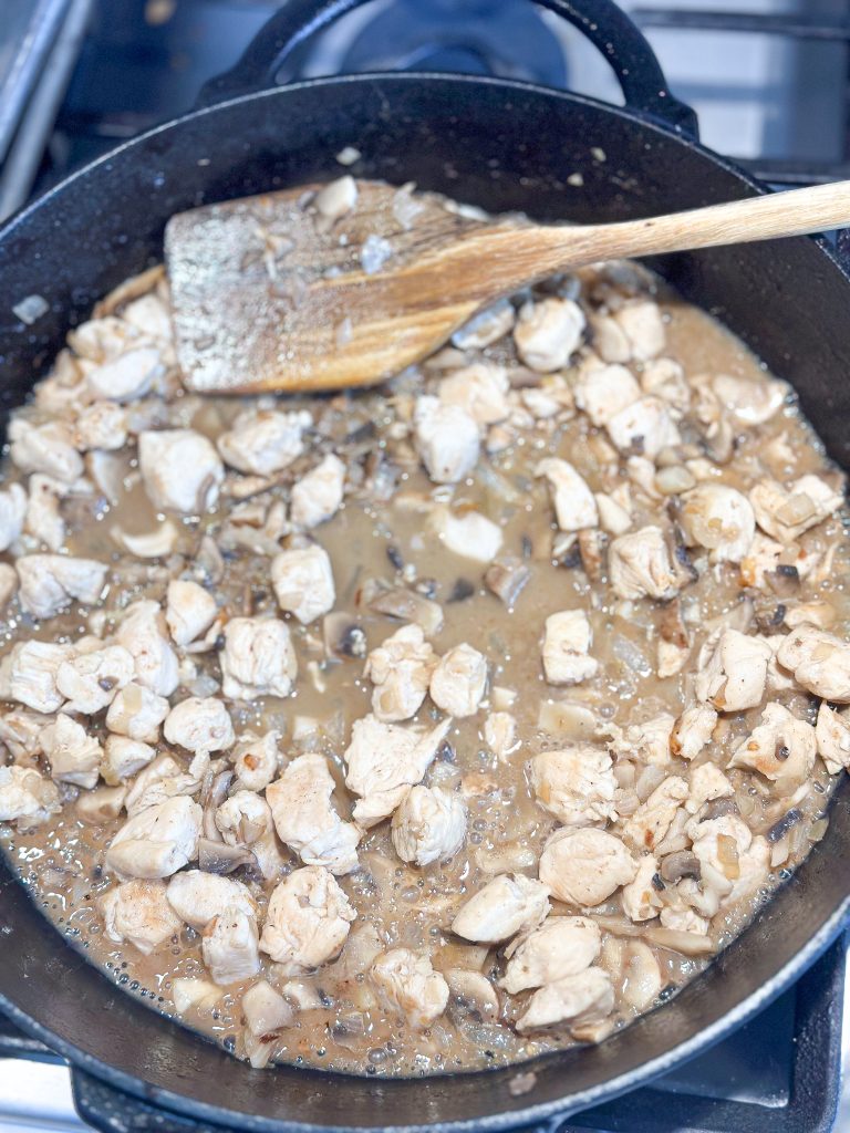 chicken, onions, garlic, mushrooms, coking in a white wine to make orzo risotto